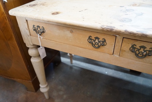 A Victorian pine two drawer side table, width 104cm, depth 52cm, height 72cm